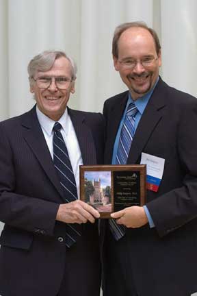 Dr. Phil Simpson receives plaque.