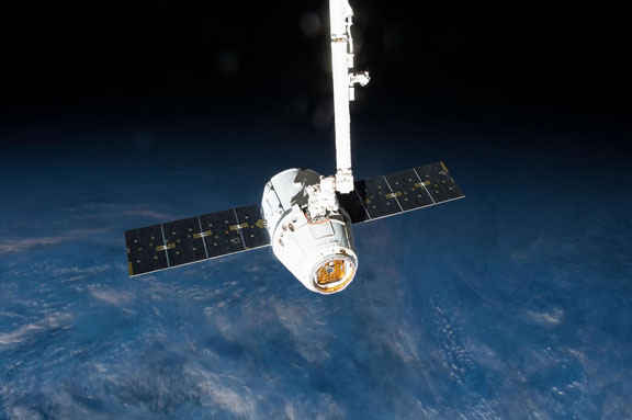 The Canadarm2 robotic arm prepares to release the SpaceX Dragon Commercial Resupply Services-6 cargo spacecraft.