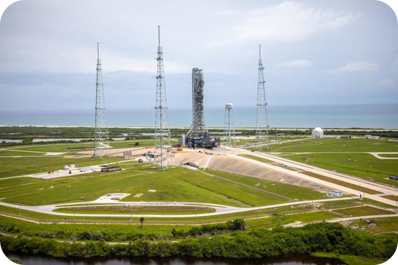 An aerial view of Launch Complex 39B with Exploration Ground Systems’ mobile launcher for the Artemis 1 mission on the pad.