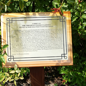 One of the descriptive garden plaques