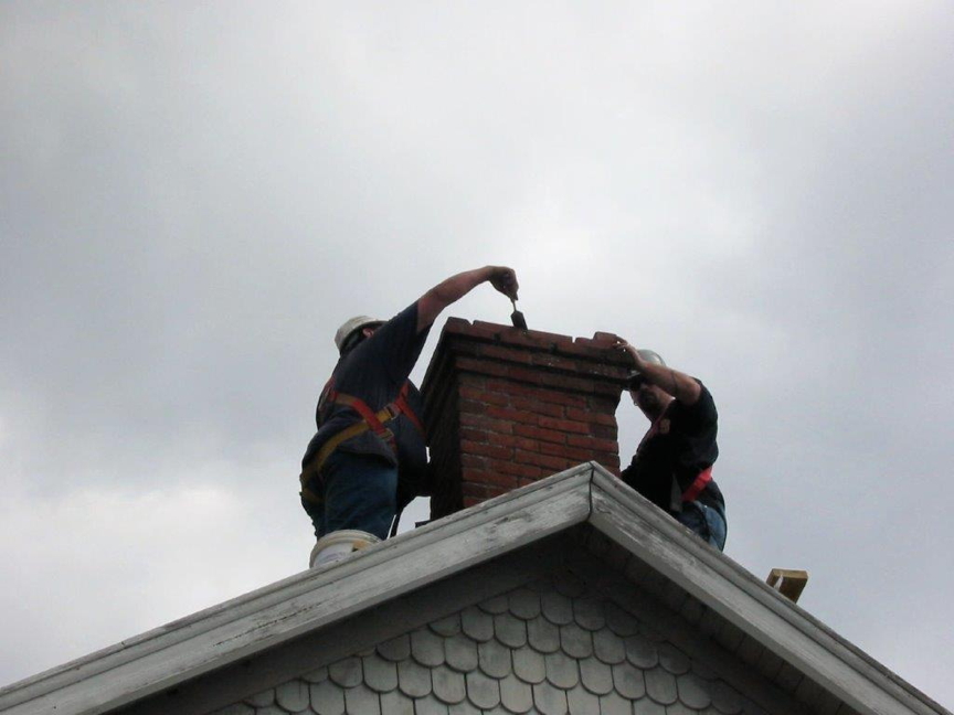 Resetting bricks on west side chimney Resetting bricks on west side chimney
