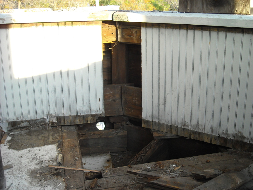 Downstairs porch before restoration.