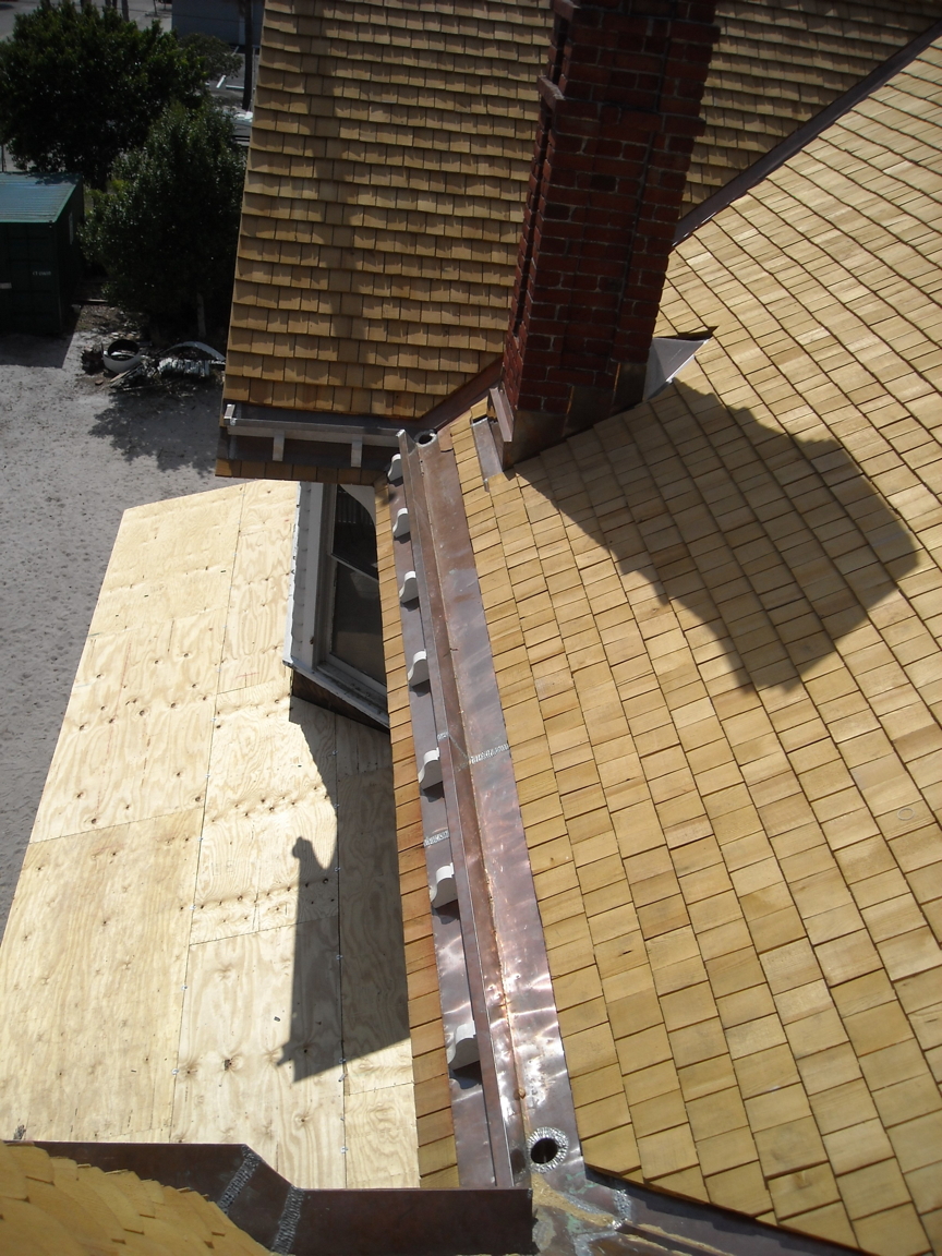 fishscale shingles being installed.