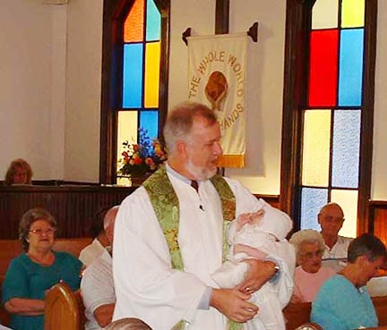 Rev. John Fisher's first baptism.